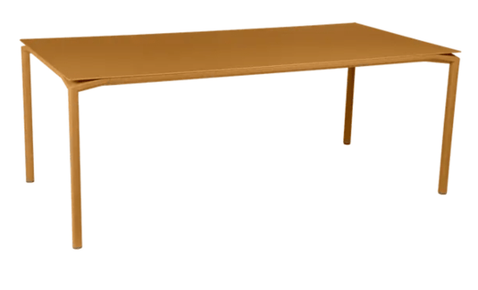 Fermob Calvi rectangular outdoor dining table, 195x95 cm, eight seater, with wooden top and metal legs, suitable for outdoor and indoor use.