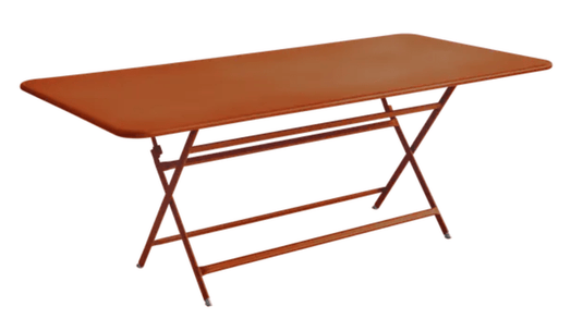 Foldable Fermob Caractère outdoor table in orange, 190x90 cm, eight-seater with a sleek, modern design.