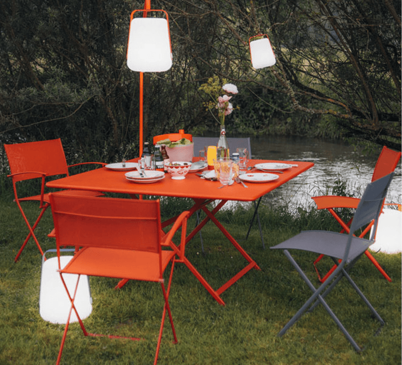 Load image into Gallery viewer, Fermob Caractère foldable outdoor table, 128x128 cm, eight-seater with sleek design and sturdy metal frame, ideal for outdoor dining.

