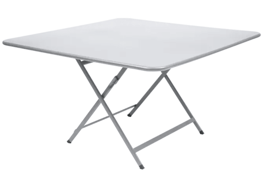 White Fermob Caractère foldable outdoor table, 128x128 cm, eight-seater, ideal for outdoor dining and gatherings.