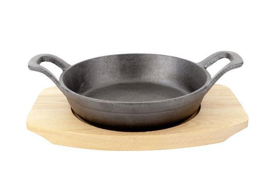 Cast iron dish with a wooden base, 155mm - Custom Wood DesignsCast iron dish with wooden base by Fine Dine, 155mm, showcasing a black cast iron cooking or serving dish on a wooden stand.cast iron dish5112637