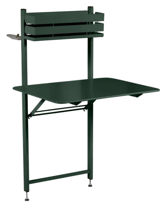 Fermob cedar green foldable balcony table with metal frame, ideal for outdoor apartment or hotel balcony use.