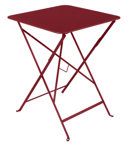 Chili red Fermob metal foldable bistro table, 57x57 inches, outdoor café table with a sleek, modern design.