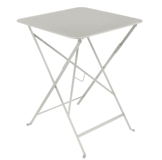 Clay grey Fermob metal foldable bistro table, 57x57 inches, outdoor cafe-style table shown with a compact, foldable design.