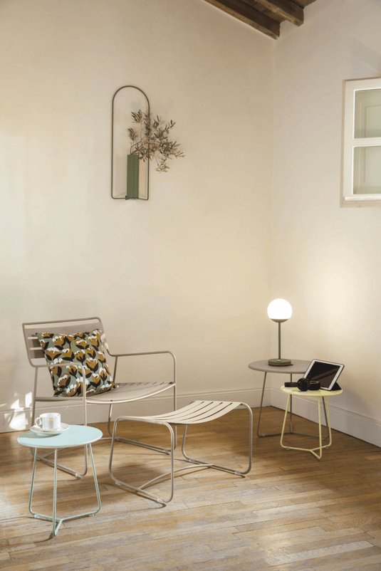 Small Fermob Cocotte Occasional Table with a round tabletop and slender legs, measuring 34cm diameter, suitable for living spaces.