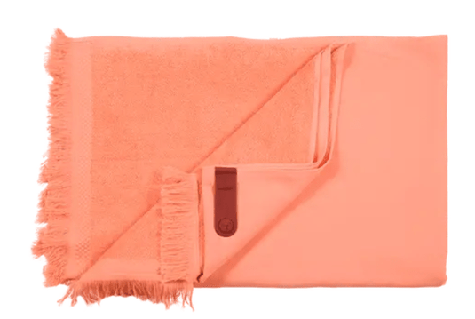 Color mix Fermob Fouta towel in coral, 200x100 cm, featuring vibrant woven fabric perfect for beach or poolside use.