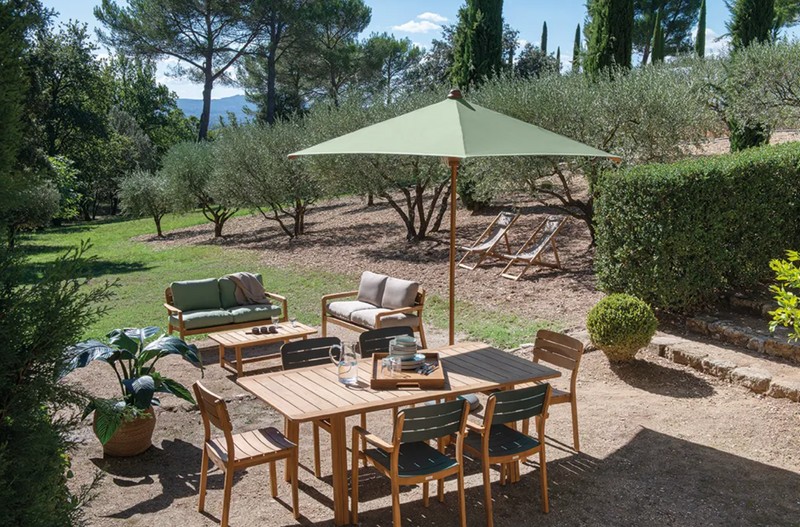 Load image into Gallery viewer, Fermob Lodge Low Armchair in teak, outdoor teak armchair with a sleek design, perfect for hotel terrace seating.
