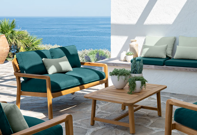Load image into Gallery viewer, Fermob Lodge outdoor teak armchair with low arms, comfortable lounge seating for hotel terrace or outdoor patio.
