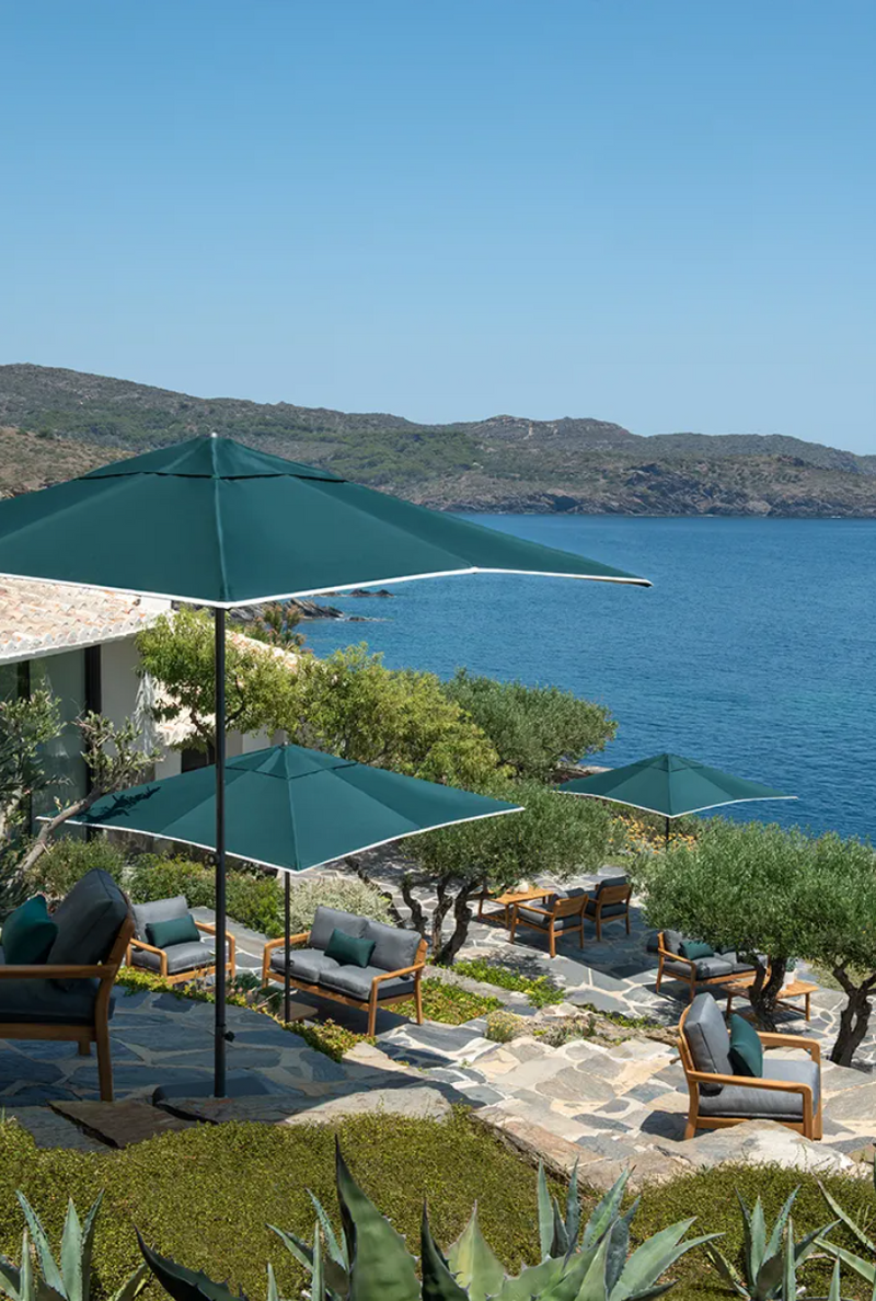 Load image into Gallery viewer, Fermob Lodge outdoor teak armchair with low armrests, ideal for hotel terrace seating, showing a modern, stylish design.
