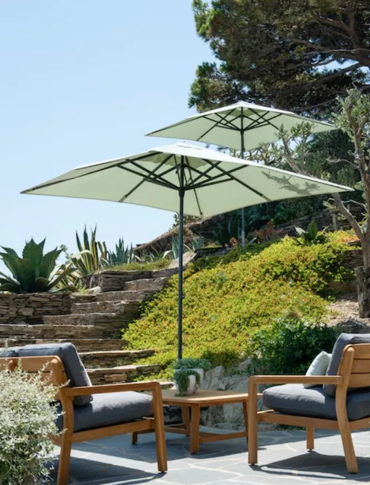 Load image into Gallery viewer, Outdoor Lodge Low Armchair by Fermob featuring teak armrests and a modern design for hotel terrace seating.
