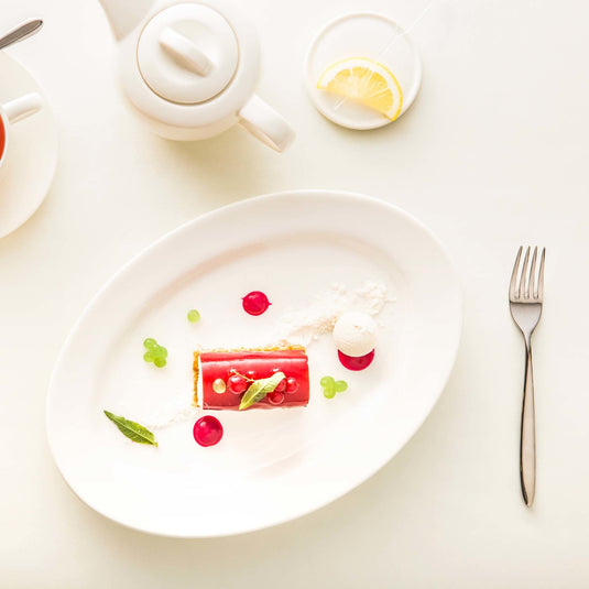 Crema oval dish, 290x200mm - Custom Wood DesignsOval ceramic platter by Fine Dine, 290x200mm, showcasing a smooth, white serving dish perfect for presenting food.platter770658