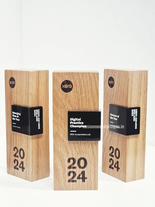 Custom Made Awards - Custom Wood DesignsCustom Wood Designs awards with engraved wood plaques, showcasing handcrafted award trophies on a wooden surface.Awards24575224368983