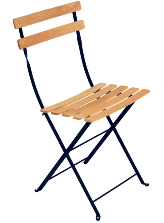 Deep blue Fermob Bistro Natural chair with wooden seat and metal frame, outdoor folding furniture for patio or garden.