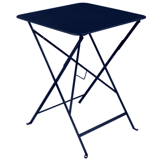 Deep blue Fermob metal foldable bistro table, 57x57 inches, ideal for outdoor cafe or patio dining, lightweight and portable.