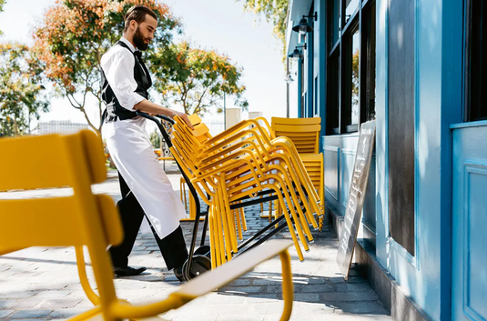 Fermob DIABLE Hand Trolley with red handle and wheels, designed for transporting goods comfortably and easily.