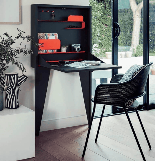 Fermob Face à Face wall-mounted writing desk in vibrant color, featuring a sleek, modern design for small workspace or study area.