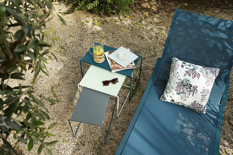 Load image into Gallery viewer, Fermob Alizé outdoor furniture in a garden setting
