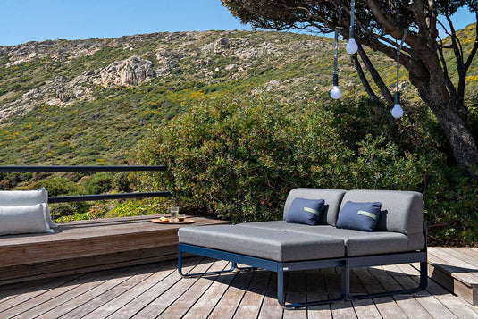 Fermob Bellevie outdoor lounge furniture in a garden setting
