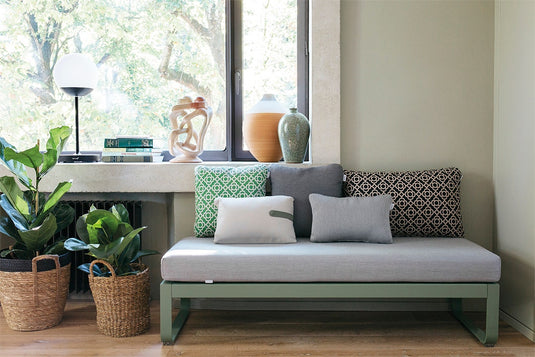 Fermob Bellevie outdoor lounge furniture in a garden setting
