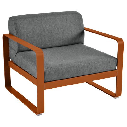 Fermob Bellevie outdoor lounge armchair– Candied Orange frame with Graphite Grey fabric cushions