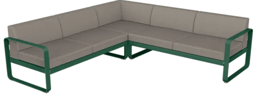 Fermob Bellevie Composition 2 outdoor lounge sofa set with cedar green, grey, and taupe cushions on a patio.