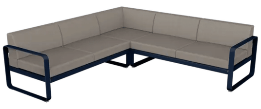 Fermob Bellevie Composition 2 outdoor modular sofa set with deep blue, grey, and taupe cushions arranged for outdoor lounging.