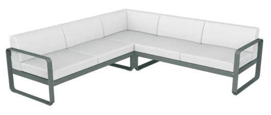 Storm grey and off-white Fermob Bellevie outdoor lounge sofa composition with modular design and stylish cushions.