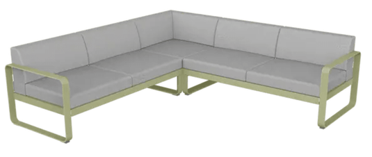 Willow green and grey Fermob Bellevie Composition 2 outdoor sofa set with modular design and plush cushions on a patio.