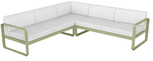 Willow green and off-white Fermob Bellevie outdoor sofa composition with modular lounge pieces on a patio setting.