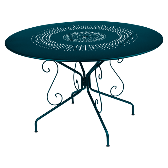 Fermob Montmartre Table Ø117 cm in Acapulco Blue – large round perforated steel garden table Ø 117 cm