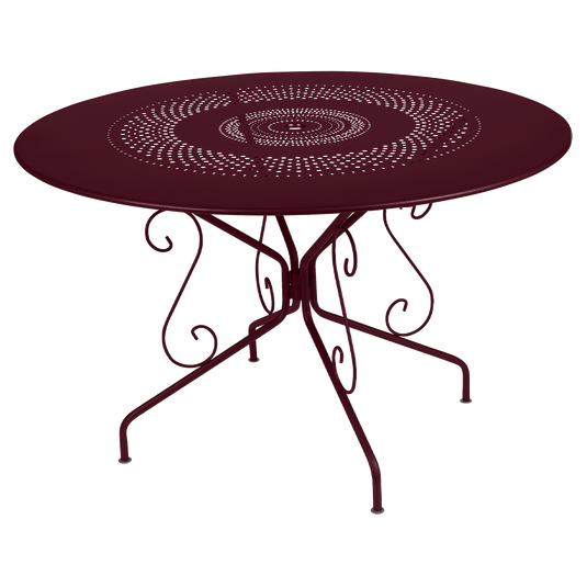 Fermob Montmartre Table Ø117 cm in Black Cherry – large round perforated steel garden table Ø 117 cm