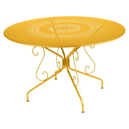 Fermob Montmartre Table Ø117 cm in Honey – large round perforated steel garden table Ø 117 cm