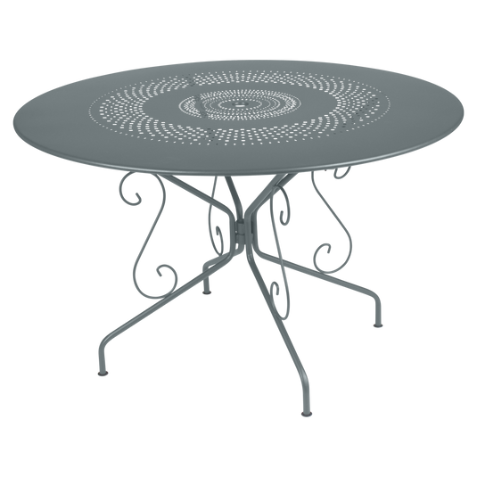 Fermob Montmartre Table Ø117 cm in Storm Grey – large round perforated steel garden table Ø 117 cm