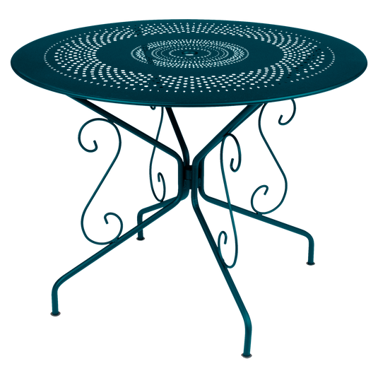 Fermob Montmartre Table Ø96 cm in Acapulco Blue – round perforated steel garden table Ø 96 cm