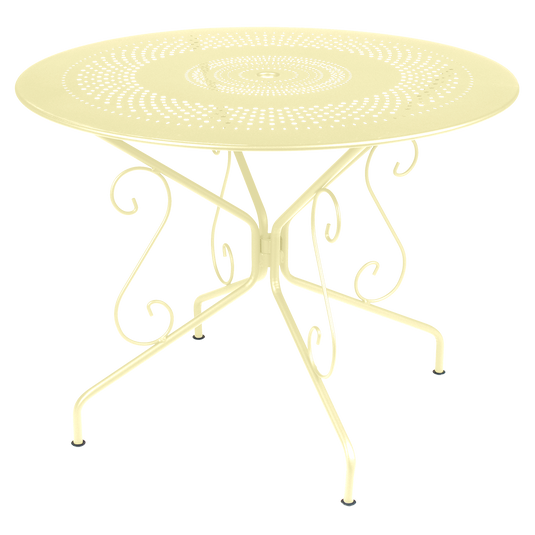 Fermob Montmartre Table Ø96 cm in Frosted Lemon – round perforated steel garden table Ø 96 cm