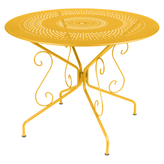 Fermob Montmartre Table Ø96 cm in Honey – round perforated steel garden table Ø 96 cm