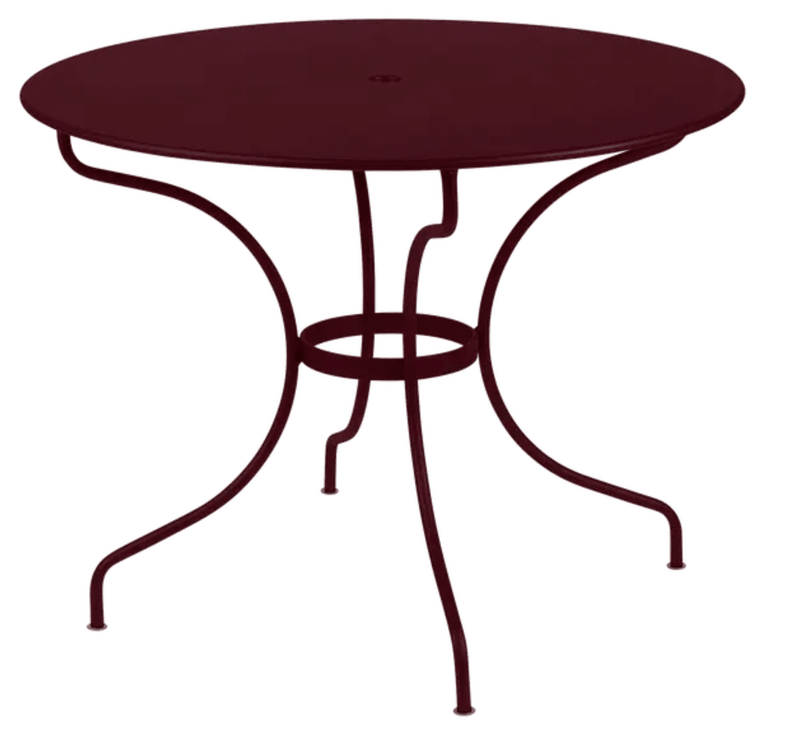 Load image into Gallery viewer, Black Fermob OPÉRA+ outdoor metal table with 96 cm diameter, designed for five-seater patio dining in black cherry finish.
