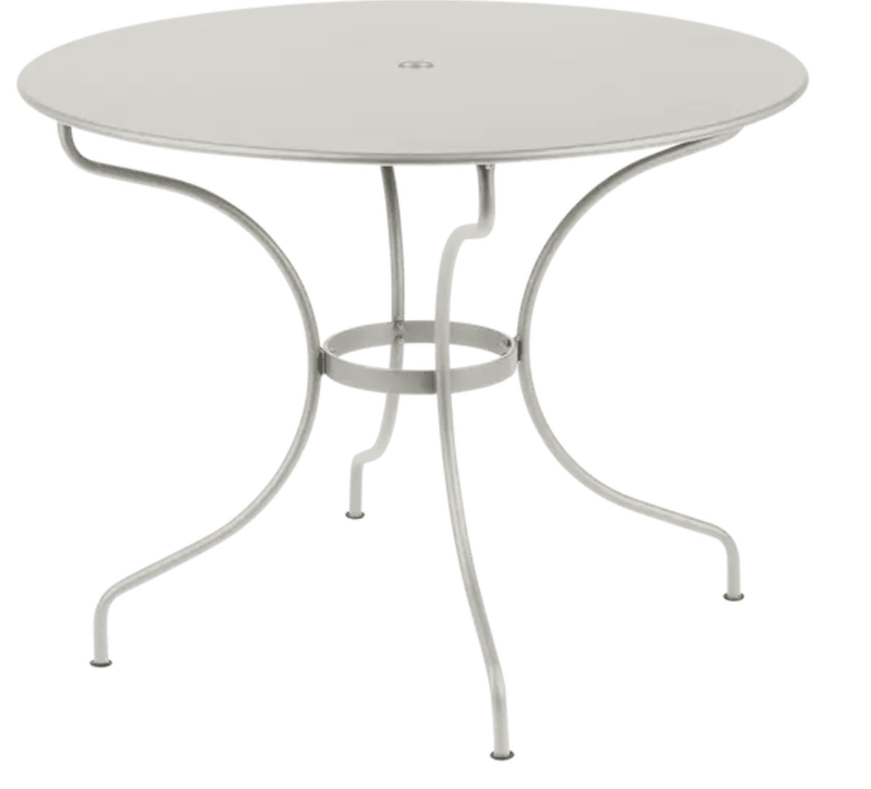 Load image into Gallery viewer, Fermob OPÉRA+ outdoor metal table with a 96 cm diameter in Cley Grey, suitable for five people on patio or garden.
