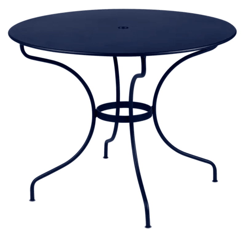 Load image into Gallery viewer, Fermob OPÉRA+ outdoor metal table in deep blue with 96 cm diameter, designed for five seater patio dining.

