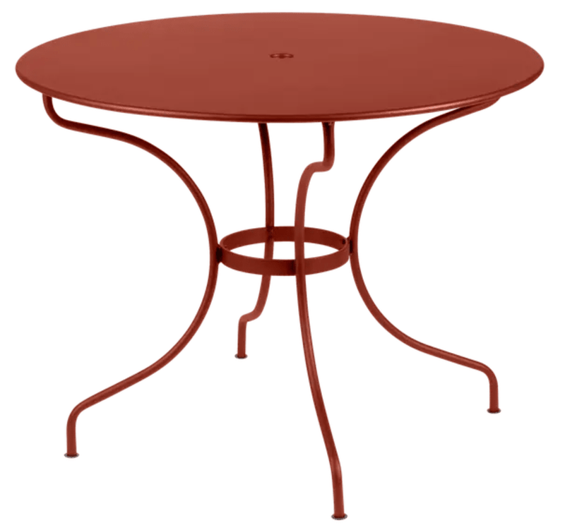 Load image into Gallery viewer, Red Ochre Fermob OPÉRA+ outdoor metal table with 96 cm diameter, suitable for five-seater patio seating.
