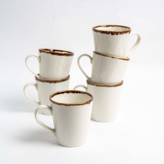Fine Dine vanilla cappuccino cup, 285ml, featuring a white ceramic design with a smooth handle and filled with frothy cappuccino.