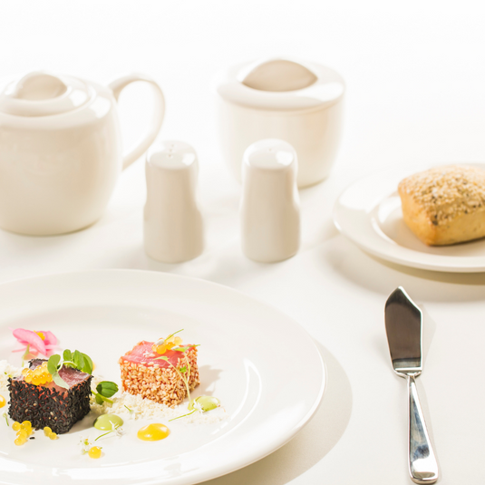 Fine Dine Crema pepper shaker, 50x70mm, with a clear glass body and black plastic top for seasoning.