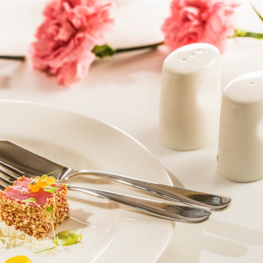 Fine Dine Crema pepper shaker, 50x70mm, with a sleek cream-colored design and metal top for easy seasoning.