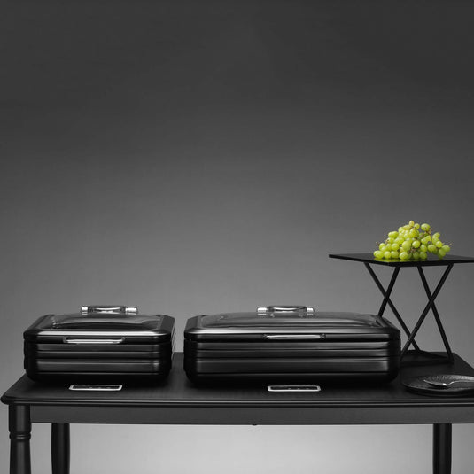 Fine Dine De Luxe black round induction chafing dish with glass lid, 9L, designed for keeping food warm professionally.