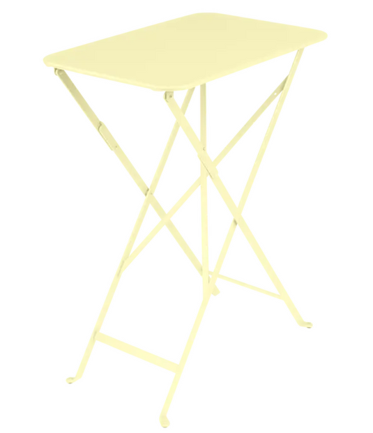 Bright yellow Fermob Bistro folding table, rectangular outdoor steel cafe table with foldable design and frosted lemon finish.