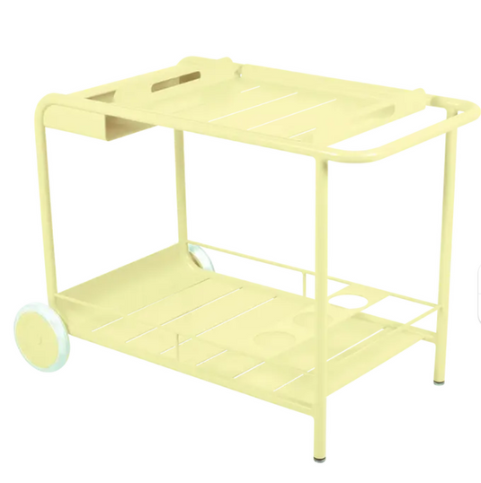 Fermob Luxembourg Side Bar trolley with frosted lemon finish, mobile table designed for restaurant terrace drinks service.