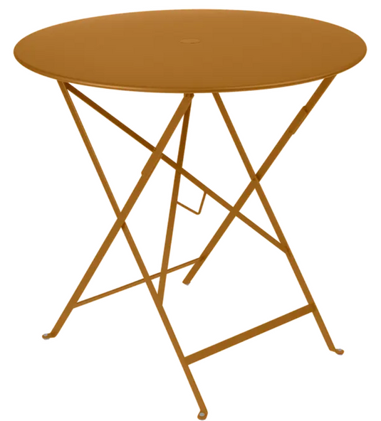 Fermob Bistro Round Table Ø77cm in gingerbread color, outdoor foldable metal table for small terraces and outdoor spaces.