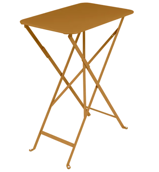 Fermob Bistro folding table in gingerbread orange with a rectangular steel design, ideal for outdoor cafes and patio use.