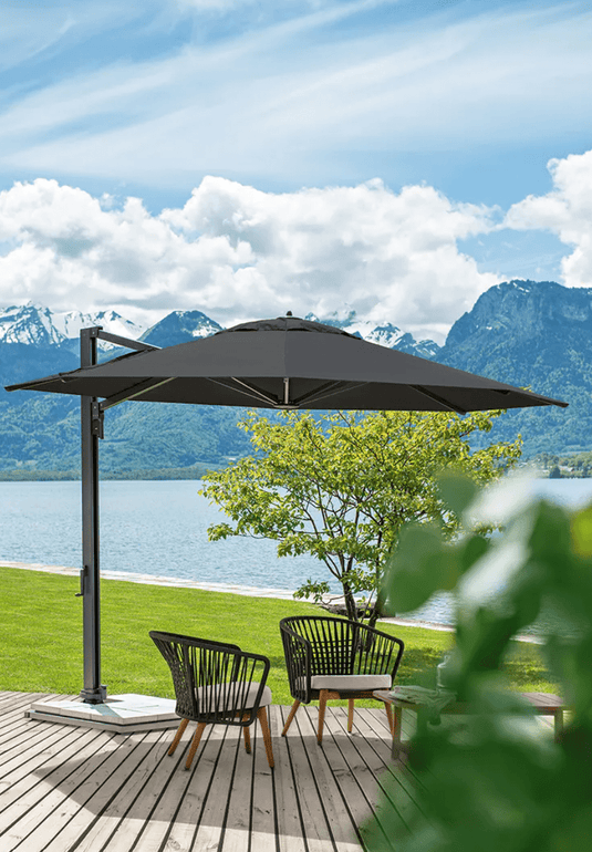 Fermob GORDES outdoor teak armchair with low arms and woven rope design, ideal for patio or garden seating.