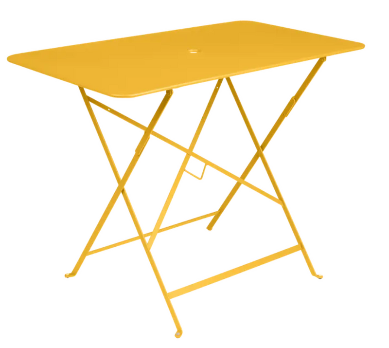 Load image into Gallery viewer, Fermob metal foldable bistro table in honey deep orange, rectangular shape, suitable for outdoor Parisian-style dining.
